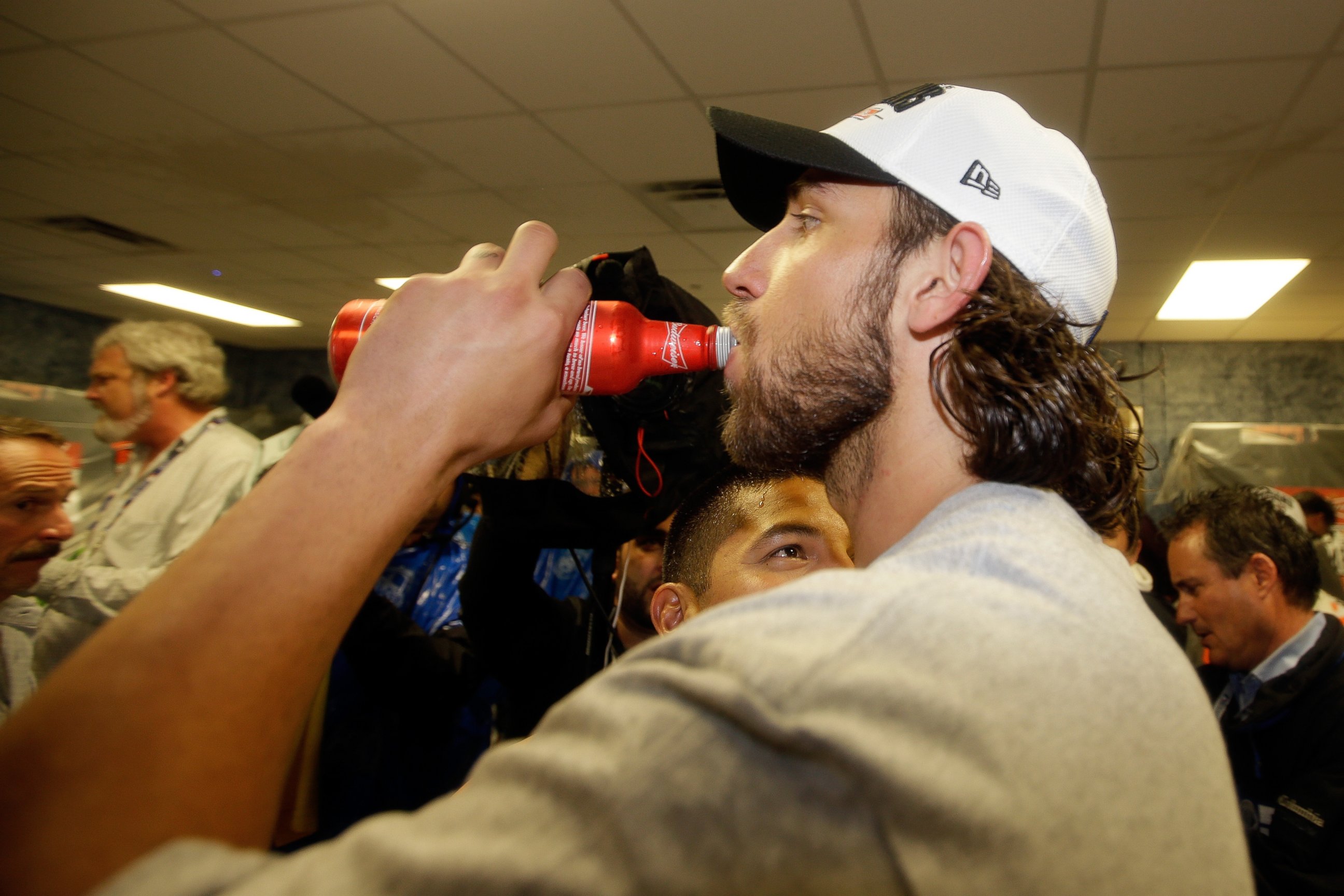 PHOTO: Madison Bumgarner of the San Francisco Giants celebrates in the locker room after defeating the Kansas City Royals during the 2014 World Series on Oct. 29, 2014 in Kansas City, Mo.  