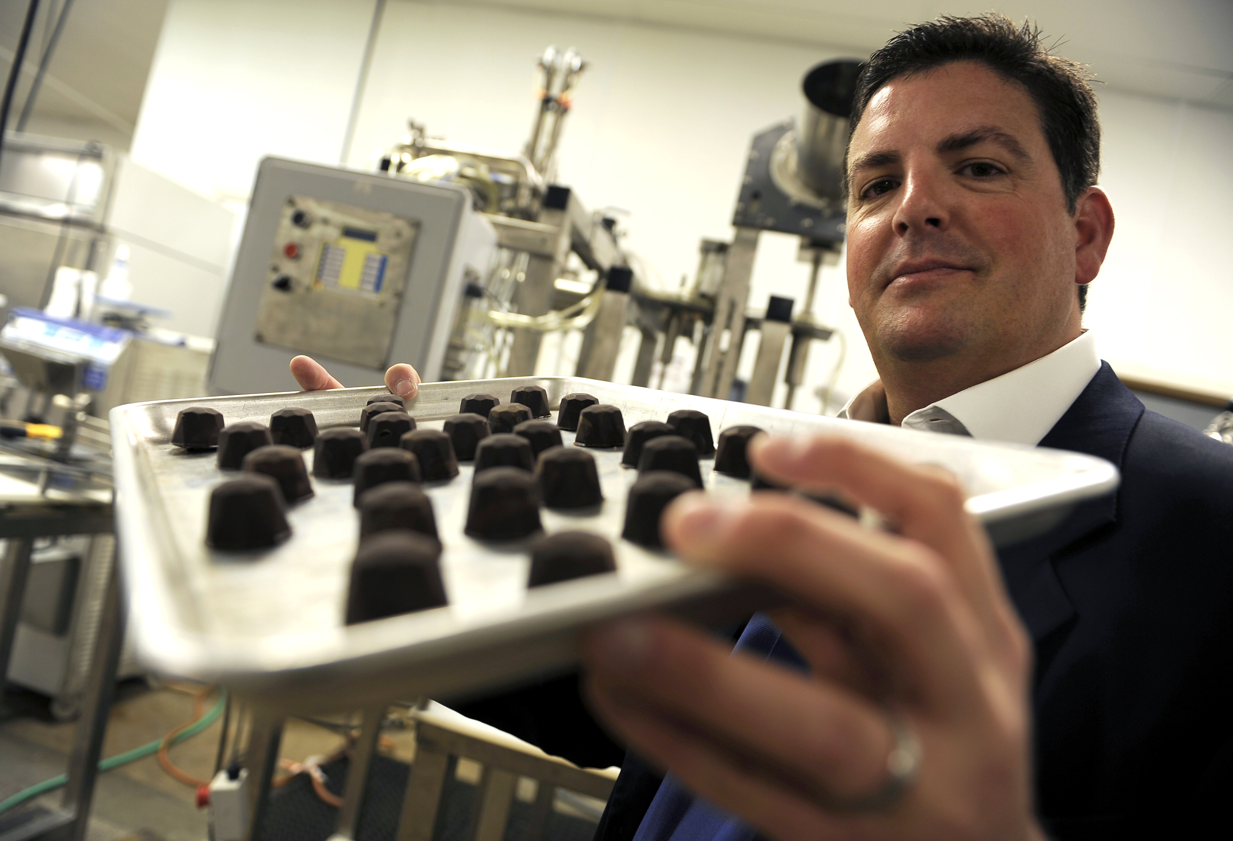 PHOTO: Tripp Keber, CEO of Dixie Elixir, runs the Denver-based medical marijuana company that produces medicated and non-medicated food items, beverages and salves, May 24, 2012.