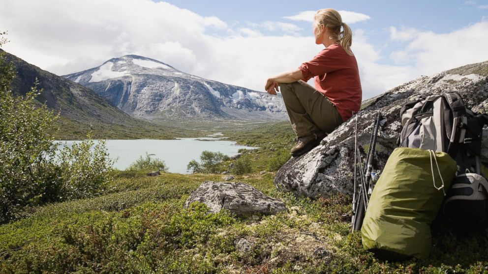 PHOTO: In this stock photo, a female hiker overlooks Strynefjellet mountain, Norway.