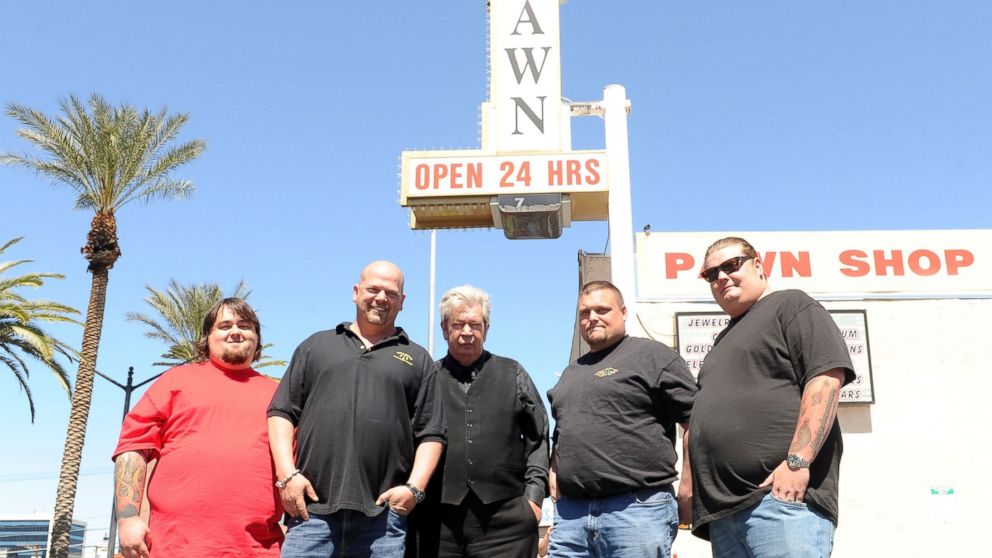 From left, "Pawn Stars" Austin "Chumlee" Russell, Rick Harrison, Richard Harrison and Corey Harrison pose for photos with "Ax Man" Gabe Rygaard at Gold and Silver Pawn in Las Vegas, Nevada, April 7, 2010.