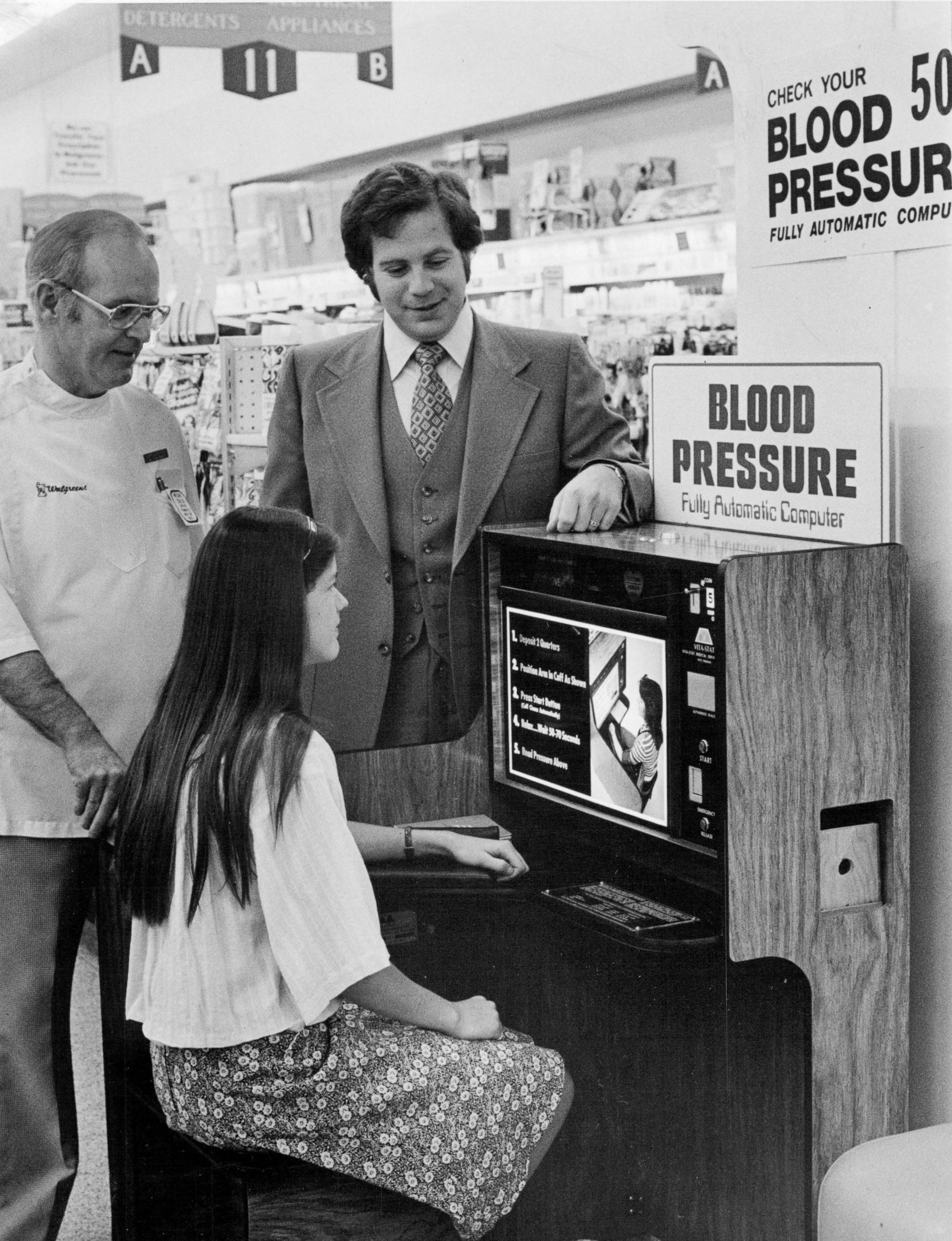 PHOTO: Walgreens employees try out an automatic blood-pressure testing machine in Denver, this May 27, 1977 file photo.