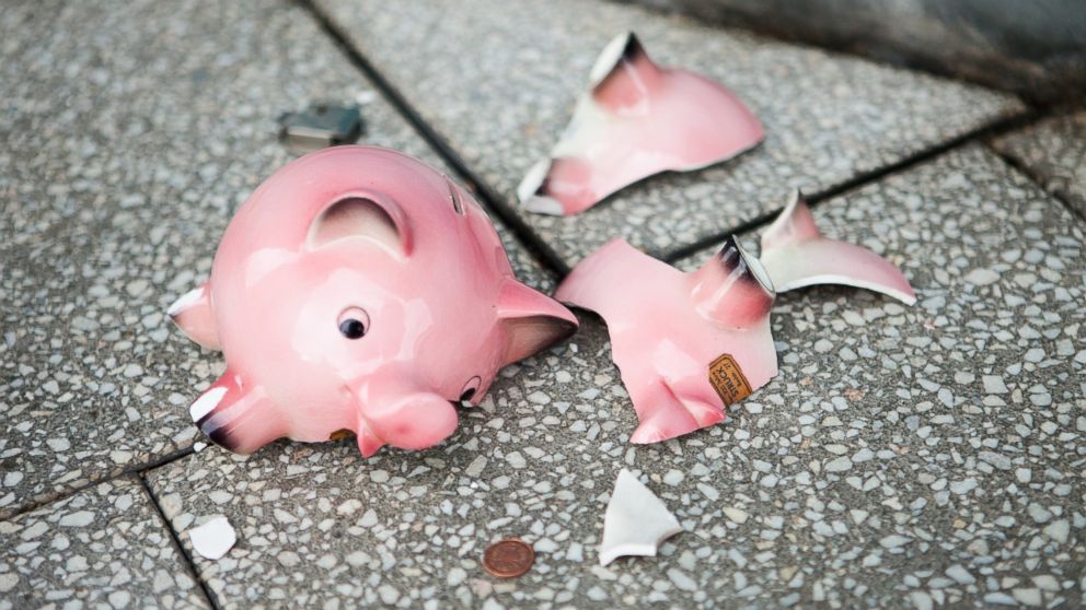 In this stock image, a broken piggy bank is pictured. 