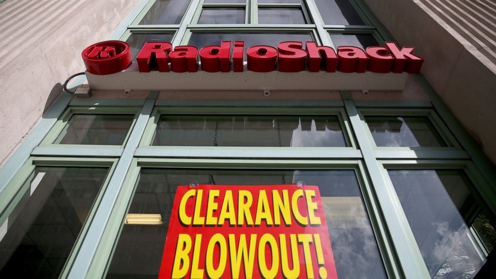 A sign reading, 'Clearance Blowout', is seen in the window of a RadioShack store, Feb. 3, 2015, in Miami.