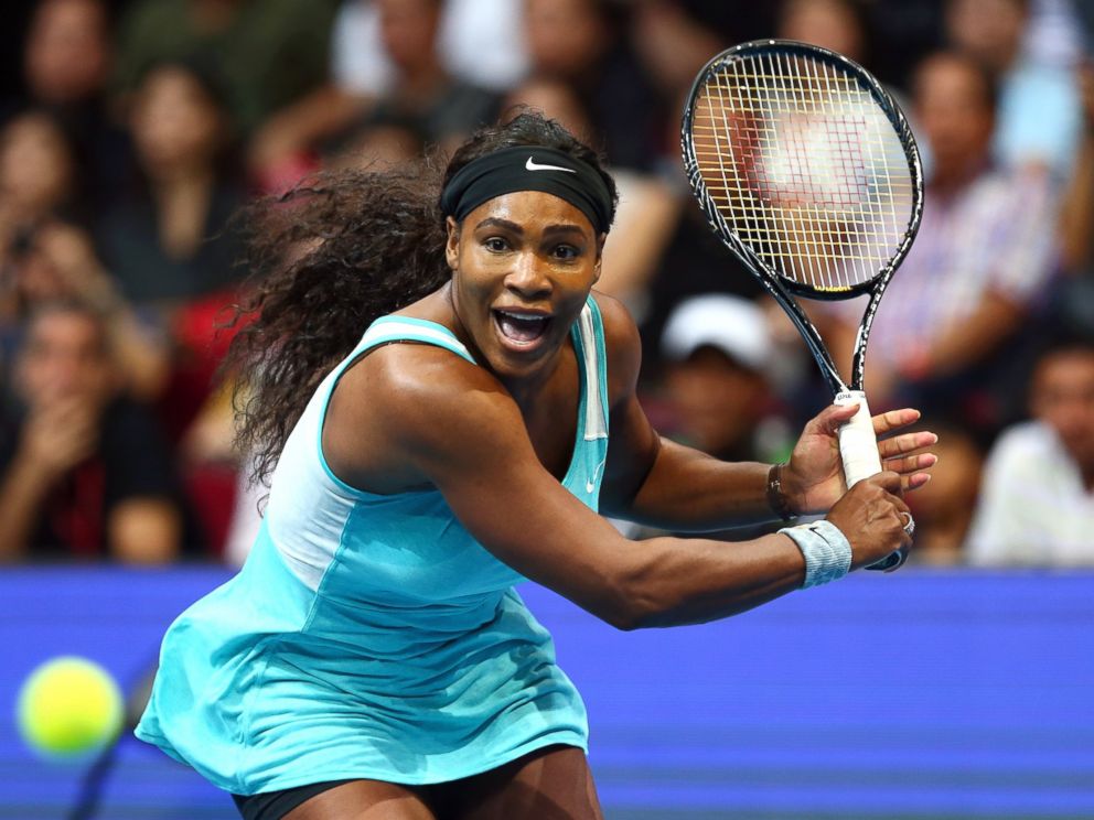 PHOTO: Serena Williams of the Singapore Slammers runs to play a backhand against Kirsten Flipkens of the Manila Mavericks during the Coca-Cola International Premier Tennis League at the Mall of Asia Arena, Nov. 30, 2014, in Manila, Philippines.