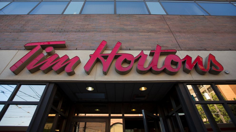 PHOTO: Tim Hortons signage is displayed outside of a restaurant in Toronto, Ontario, Canada on Sept. 16, 2013. 