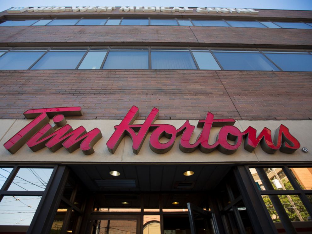 PHOTO: Tim Hortons signage is displayed outside of a restaurant in Toronto, Ontario, Canada on Sept. 16, 2013.