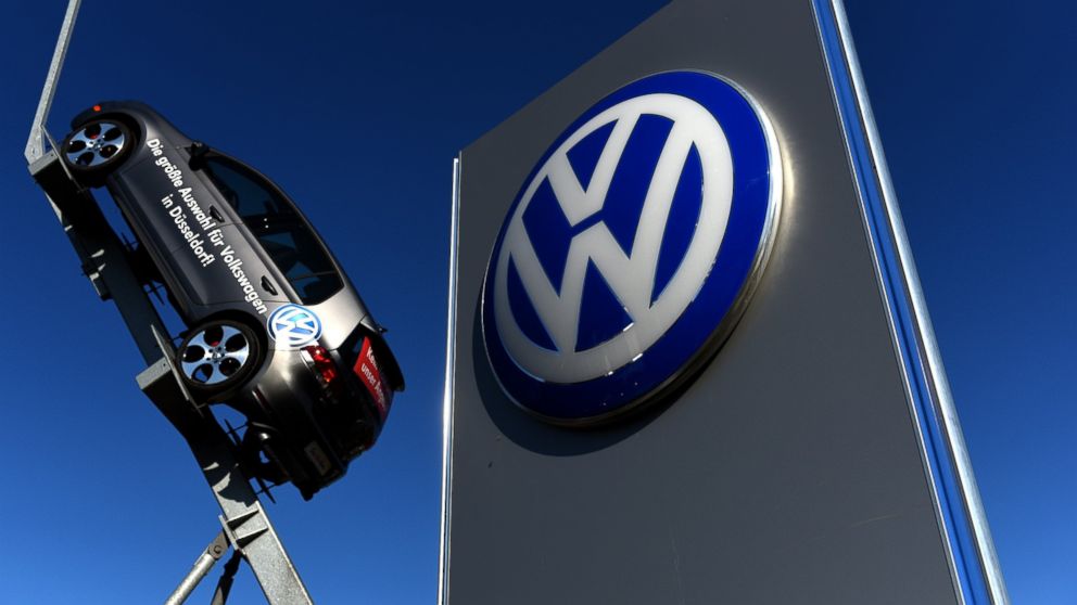 A model and logo of German car maker Volkswagen are seen at the entrance to a VW branch in Duesseldorf, Germany on Sept. 28, 2015.  