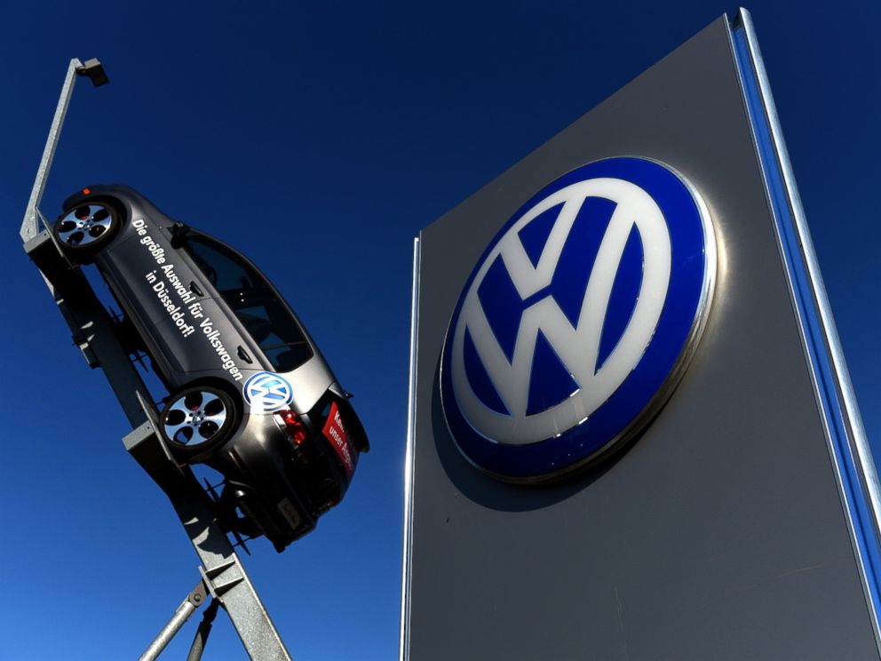 PHOTO: A model and logo of German car maker Volkswagen are seen at the entrance to a VW branch in Duesseldorf, Germany on Sept. 28, 2015.