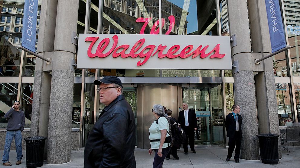 A patron walks by a Walgreens in Boston, May 1, 2013.