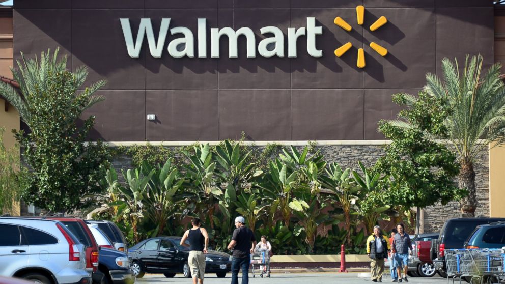 Shoppers are seen outside a Wal-Mart store in Rosemead, Calif., in this Jan. 29, 2014, file photo.  