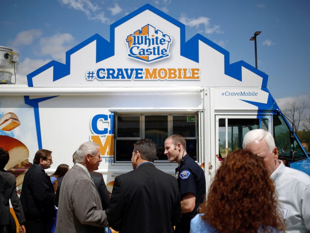 PHOTO: Attendees of the grand opening for the new White Castle Co. Distributing Plant stand in line at the White Caste Cravemobile food truck in Vandalia, Ohio, April 30, 2014.
