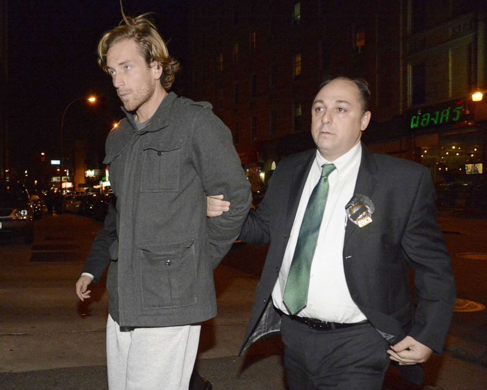 PHOTO:Thomas Gilbert, Jr. is walked into Central Booking at Manhattan Criminal Court, 
Jan. 5, 2015. Gilbert is charged with murdering his father, hedge fund owner Thomas Gilbert, Sr. 