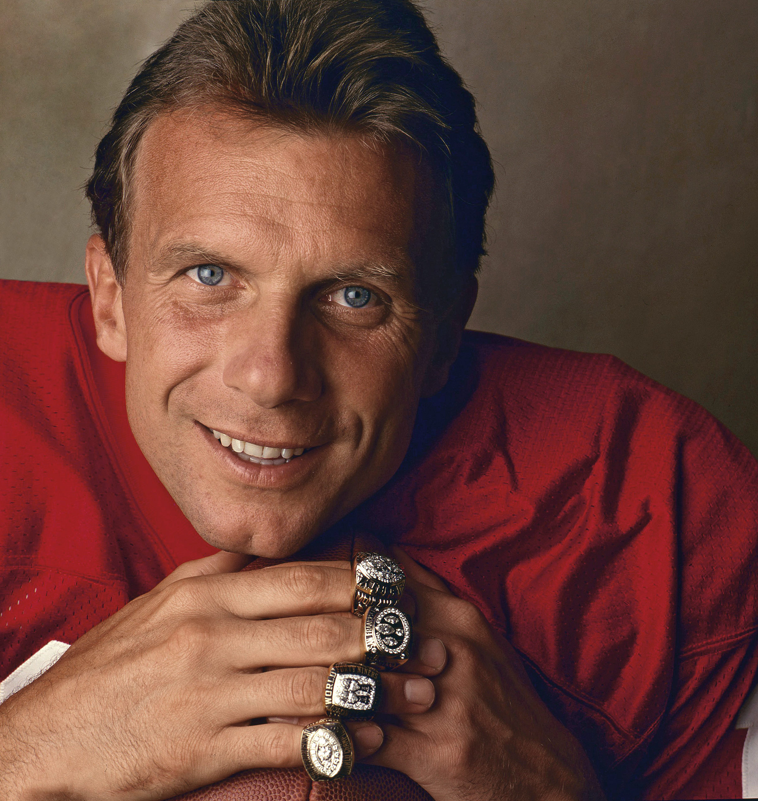 PHOTO: San Francisco 49ers Hall of Fame quarterback Joe Montana poses with his four Super Bowl rings for his ProLine Profile trading card during a photo shoot in Santa Clara, Calif., on April 21, 1992. 