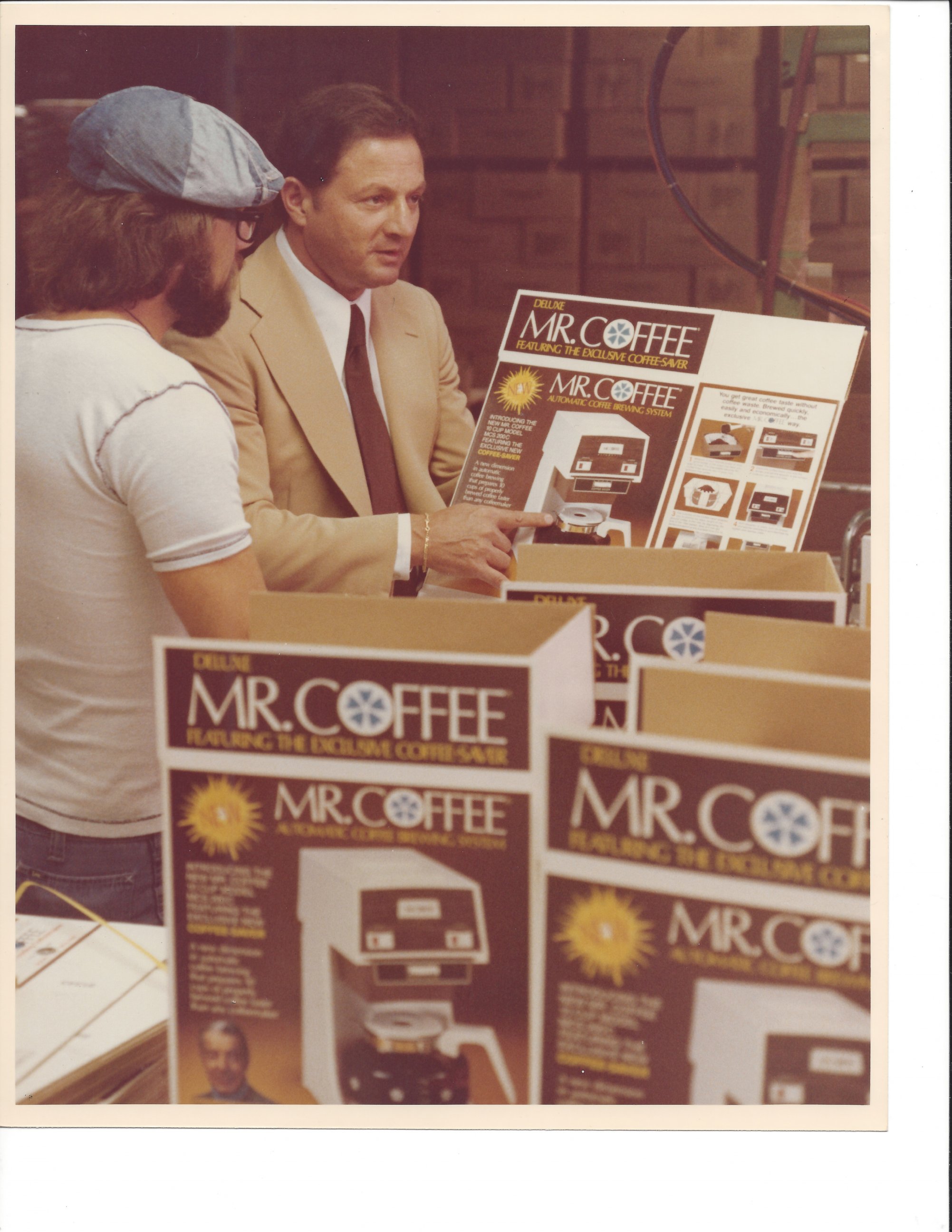 PHOTO: In this file photo, Vincent Marotta looks over the product packaging of Mr. Coffee, 1978. 