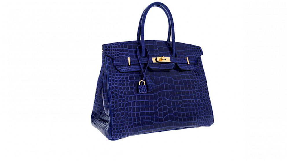 Heritage Auctions is selling this Hermes "Special Order Horseshoe 35cm Shiny Blue Electric & Indigo Porosus Crocodile Birkin Bag with Gold Hardware," estimated to sell for $60,000 to $70,000. 