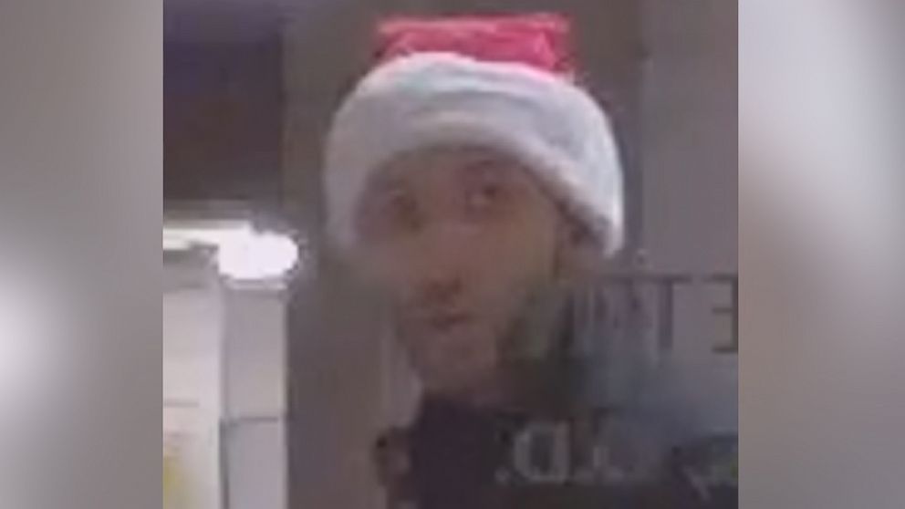 Police in Hillsborough are asking for the public's help to identify a Santa Claus hat-wearing man suspected of burglarizing a home and business, Dec. 25, 2015.