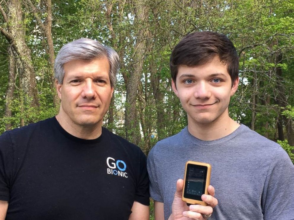 PHOTO: Edward Damiano, president of Beta Bionics, Inc., holds the company’s iLet bionic pancreas device, with his son David. 