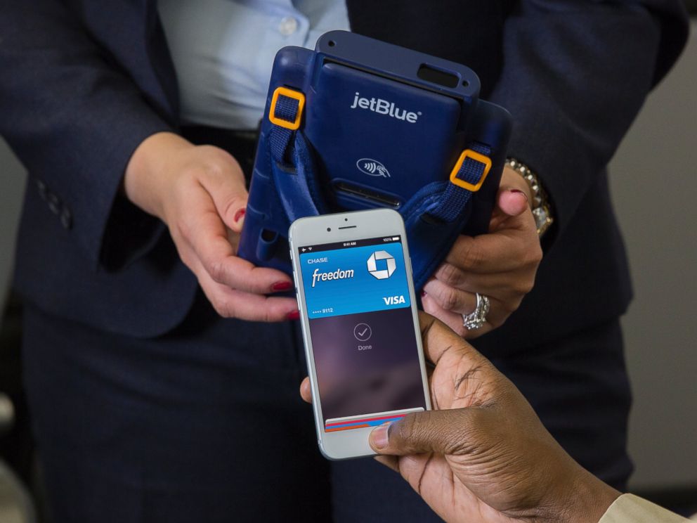 PHOTO: A JetBlue passenger uses the in-flight Apple Pay system.