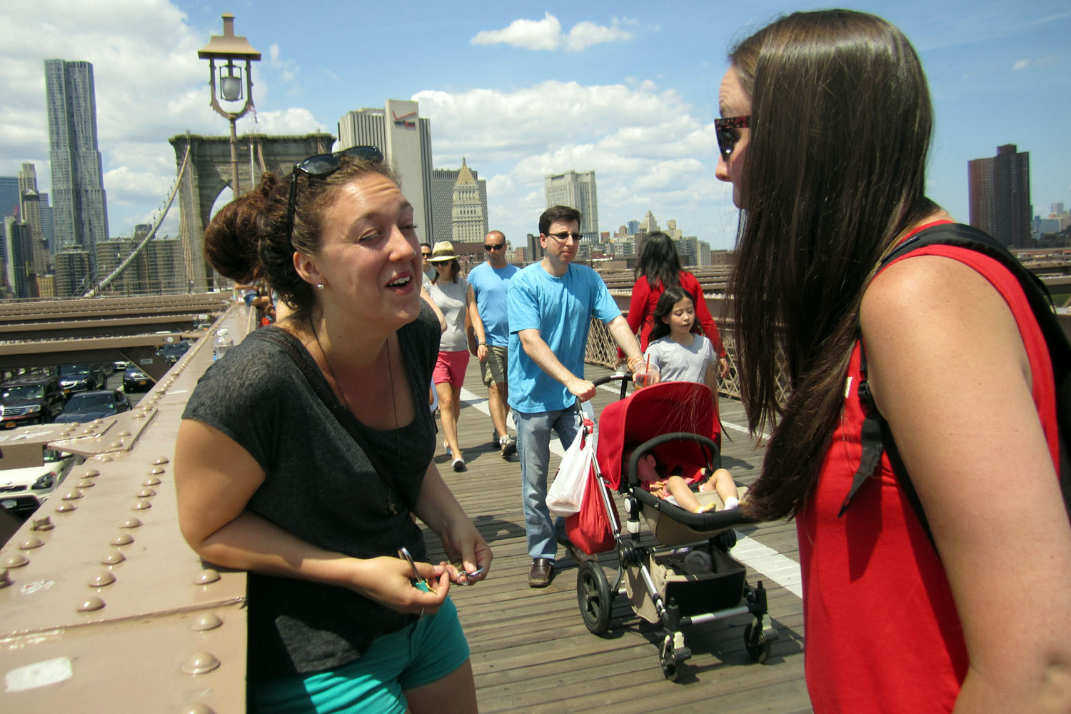 PHOTO: Olivia Fader, left, and Mal Harris, both of Halifax, Nova Scotia, get engaged on the Brooklyn Bridge.