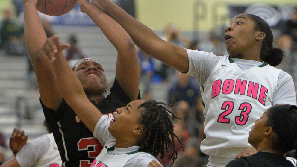 High school athletes support breast cancer awareness with pink uniforms  (Photos)