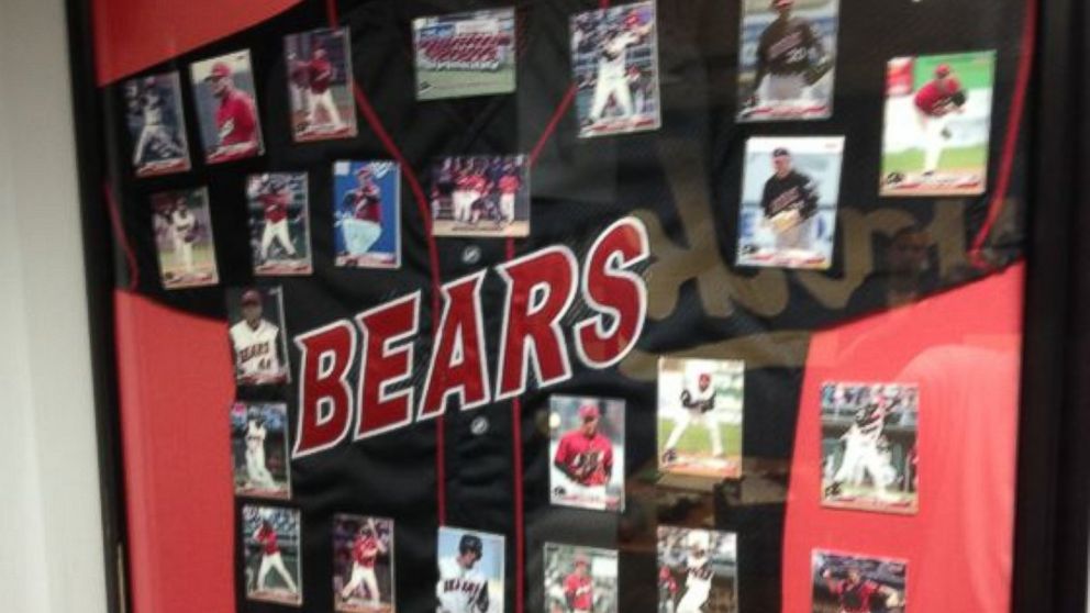 PHOTO: A Newark Bears framed black jersey, the team's 2005-2008 design, with trading cards of the team's players mounted above it, as part of a liquidation sale by the Newark Bears.