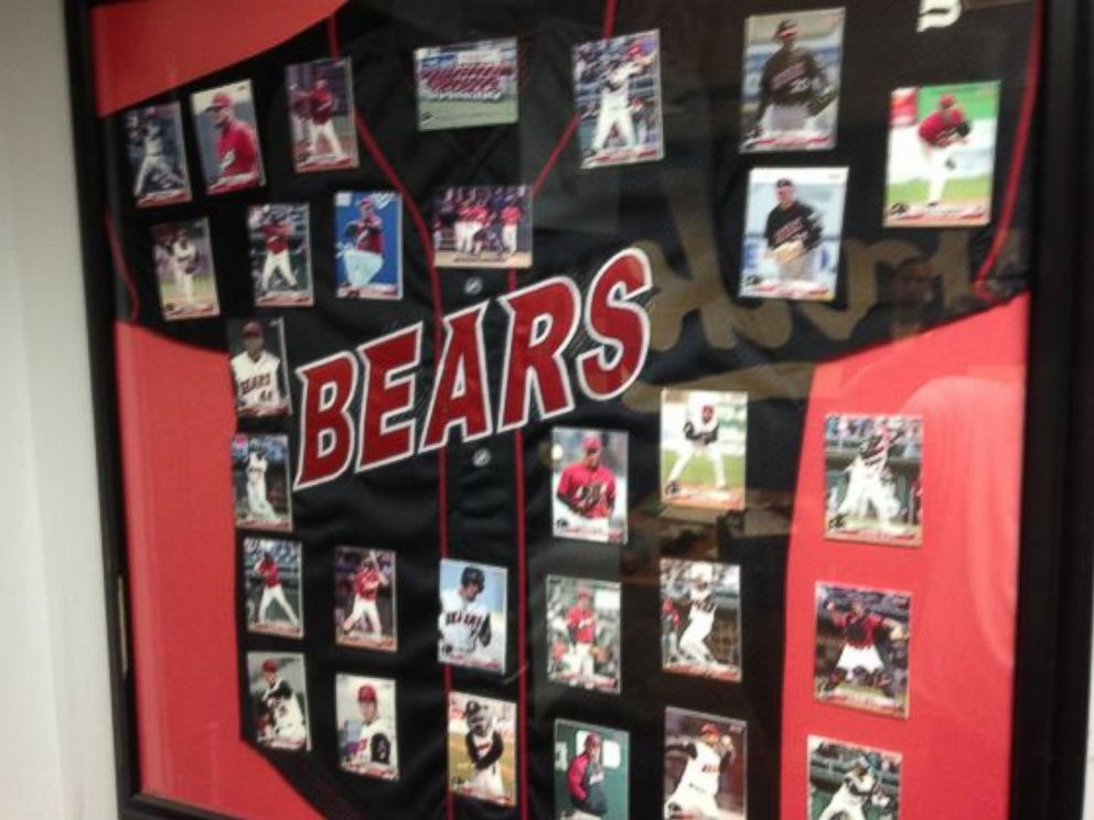 PHOTO: A Newark Bears framed black jersey, the team's 2005-2008 design, with trading cards of the team's players mounted above it, as part of a liquidation sale by the Newark Bears.