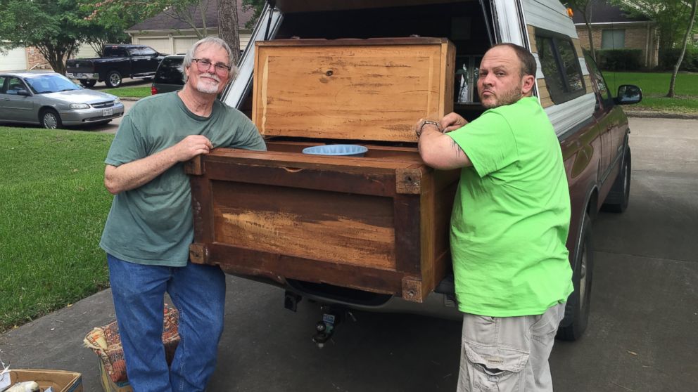 PHOTO: Premier Estate Sales representative Nathan Taylor and buyer of the dresser, Emil Knodell,  are shown in this photo.
