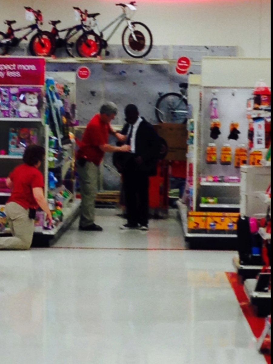 PHOTO: Target workers help a young man prep for job interview.