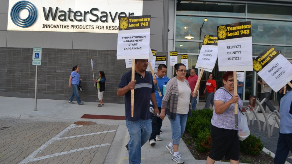 Members of the Teamsters Local 743 chapter participate in a "Stop Bathroom Harassment, Start Bargaining" rally in front faucet maker WaterSaver in Chicago.