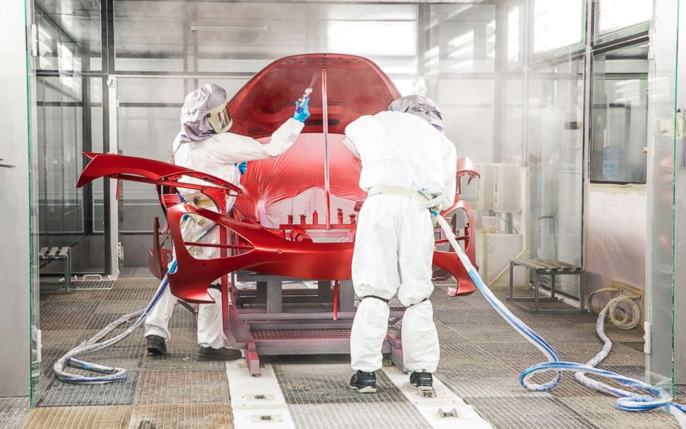 PHOTO: Workers paint a McLaren at the production center in England. 