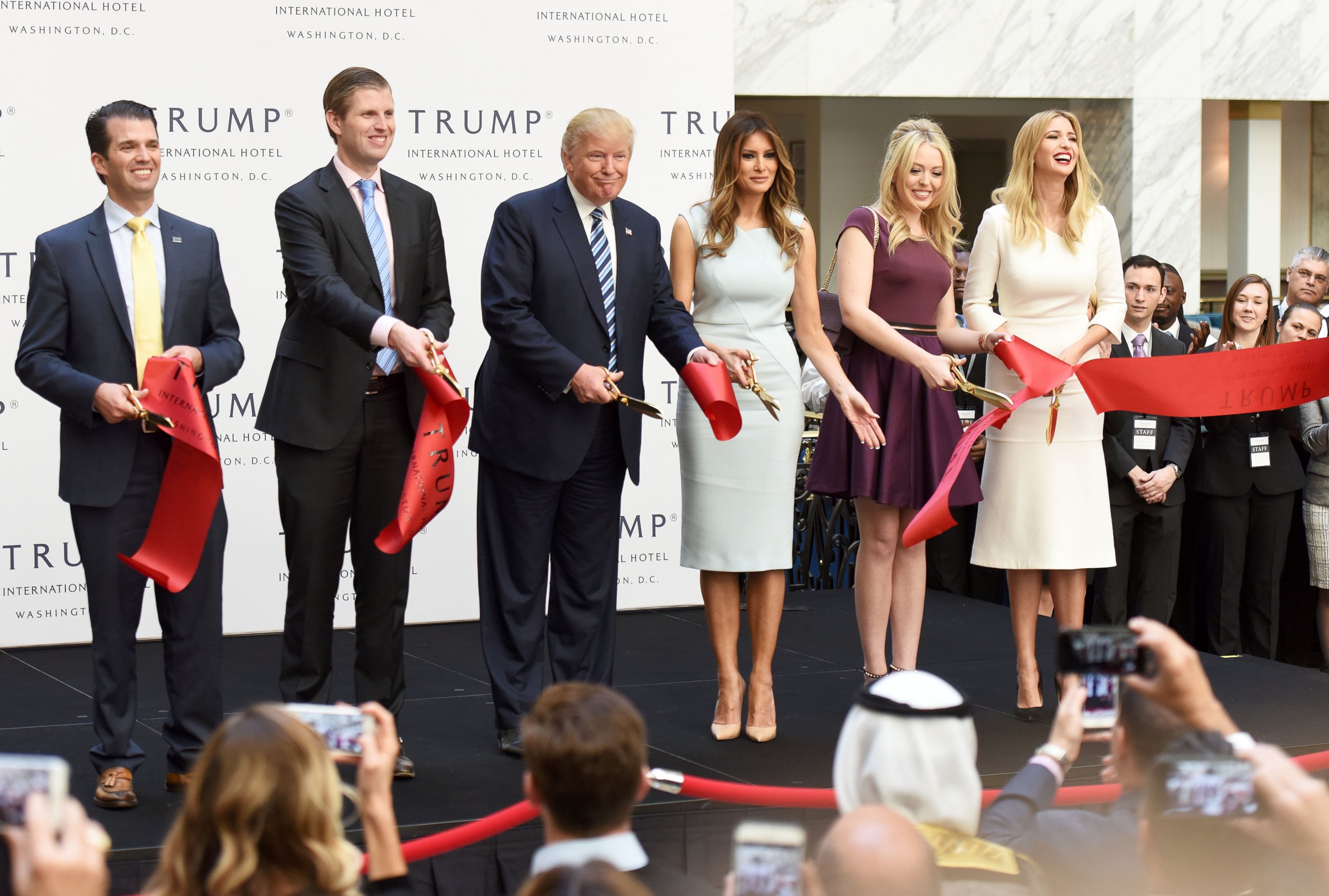 PHOTO: Republican presidential nominee Donald Trump and his family members cut the ribbon during the opening and ribbon cutting ceremony of Trump International Hotel in Washington, D.C., on Oct. 26, 2016.
