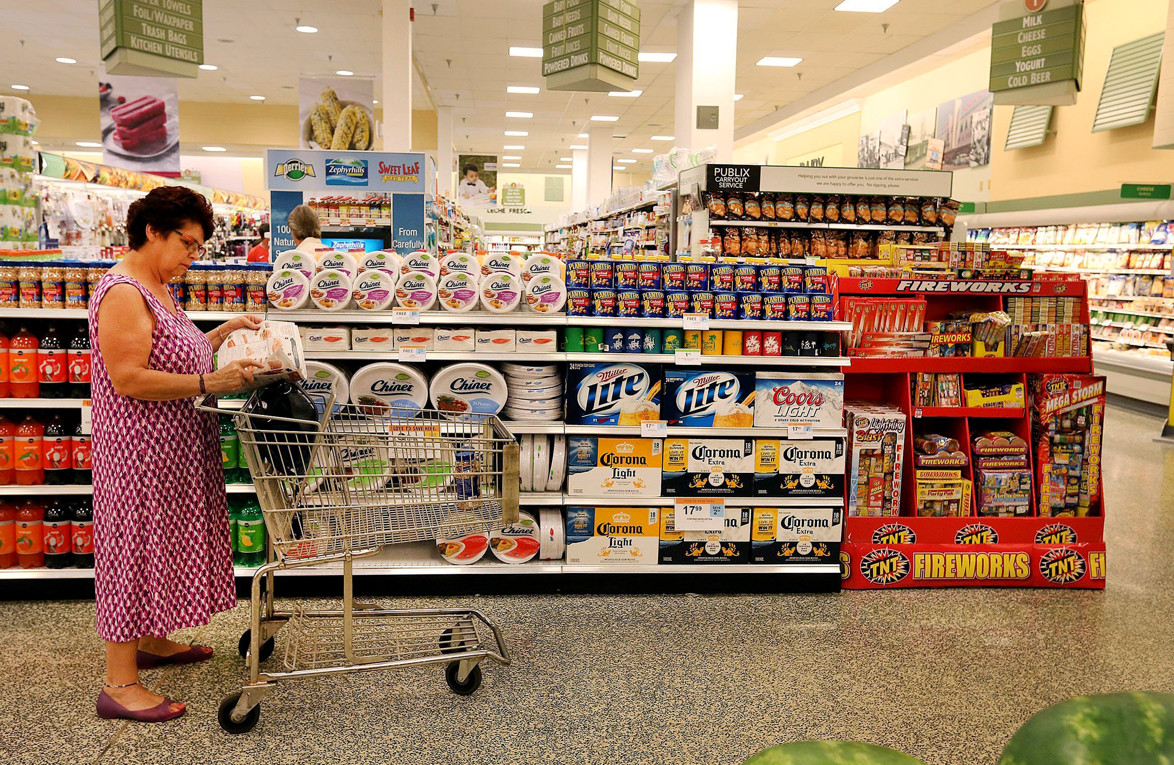 PHOTO: A patron checks for sale items as she pauses near a Publix display in this file photo.