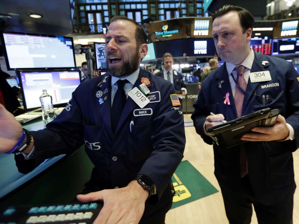 PHOTO: Specialist Michael Pistillo, left, and trader Brandon Barb work on the floor of the New York Stock Exchange, Feb. 5, 2018.