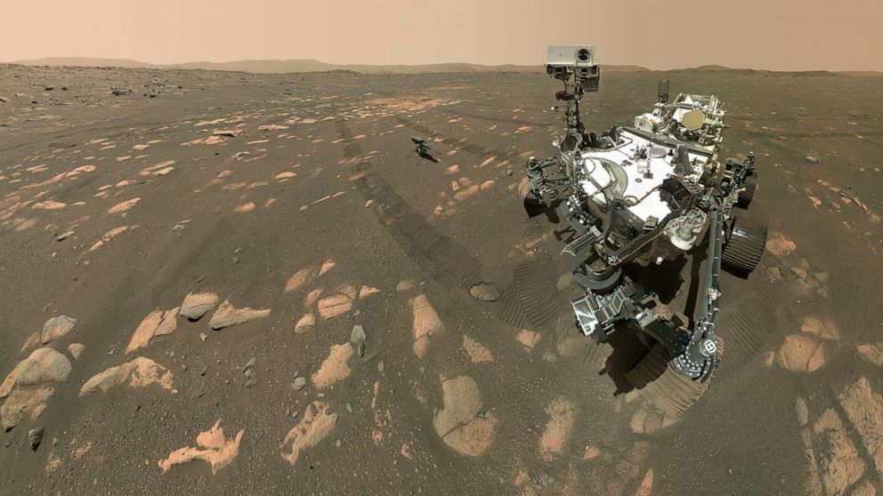 PHOTO: NASA’s Perseverance Mars rover took a selfie with the Ingenuity helicopter, seen here about 13 feet from the rover in this image taken April 6, 2021.
