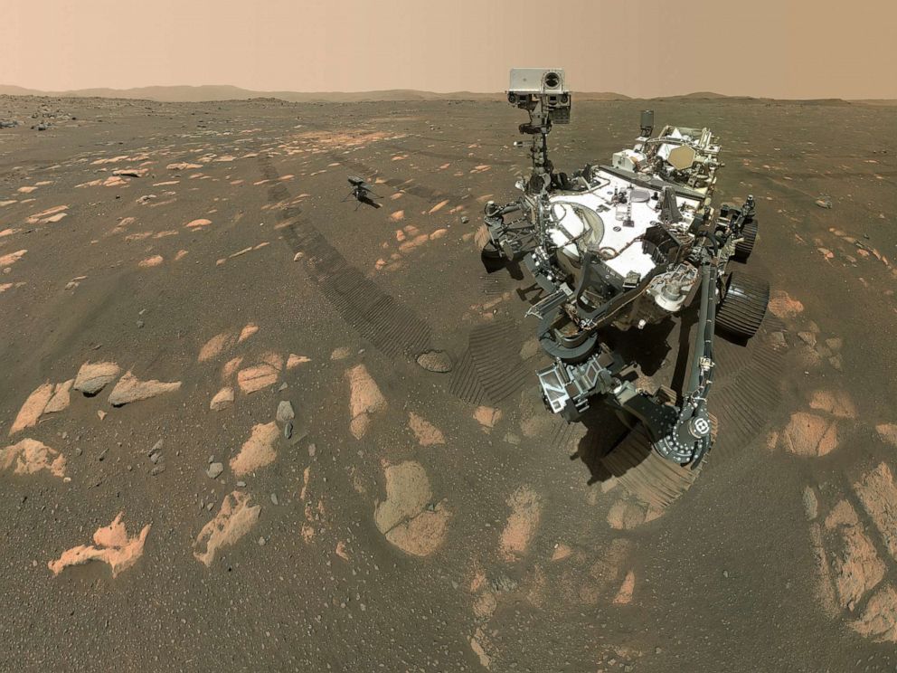 PHOTO: NASA’s Perseverance Mars rover took a selfie with the Ingenuity helicopter, seen here about 13 feet from the rover in this image taken April 6, 2021.
