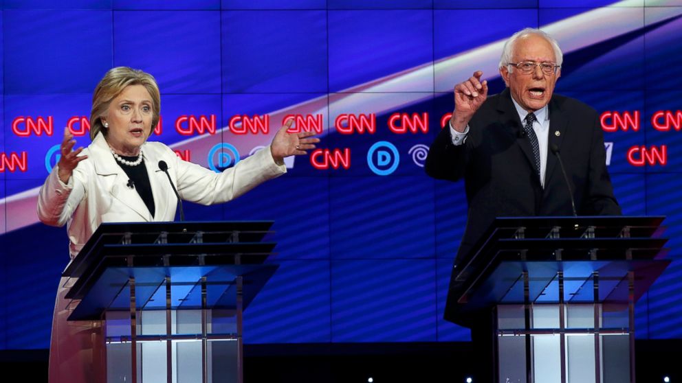 PHOTO: Democratic U.S. presidential candidates Hillary Clinton (L) and Senator Bernie Sanders speak simultaneously during a Democratic debate hosted by CNN and New York One at the Brooklyn Navy Yard in New York on April 14, 2016.  