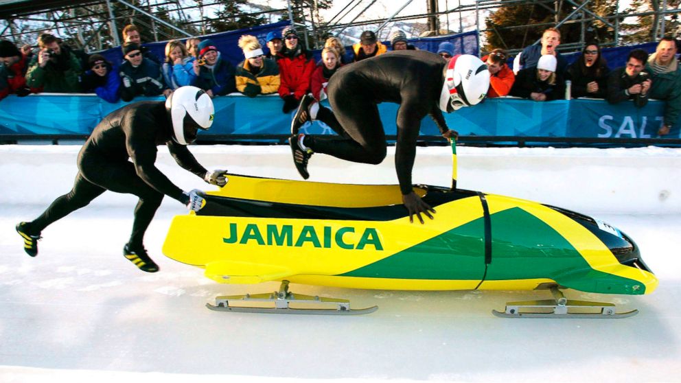 PHOTO: Lascelles Oneil Brown, left, and Winston Alexander Watt of the Jamaica-1
team leap into their sled at the start of heat three of the two-man bobsleigh competition at the Salt Lake 2002 Winter Olympic Games, Feb. 17, 2002 in Park City, Utah.