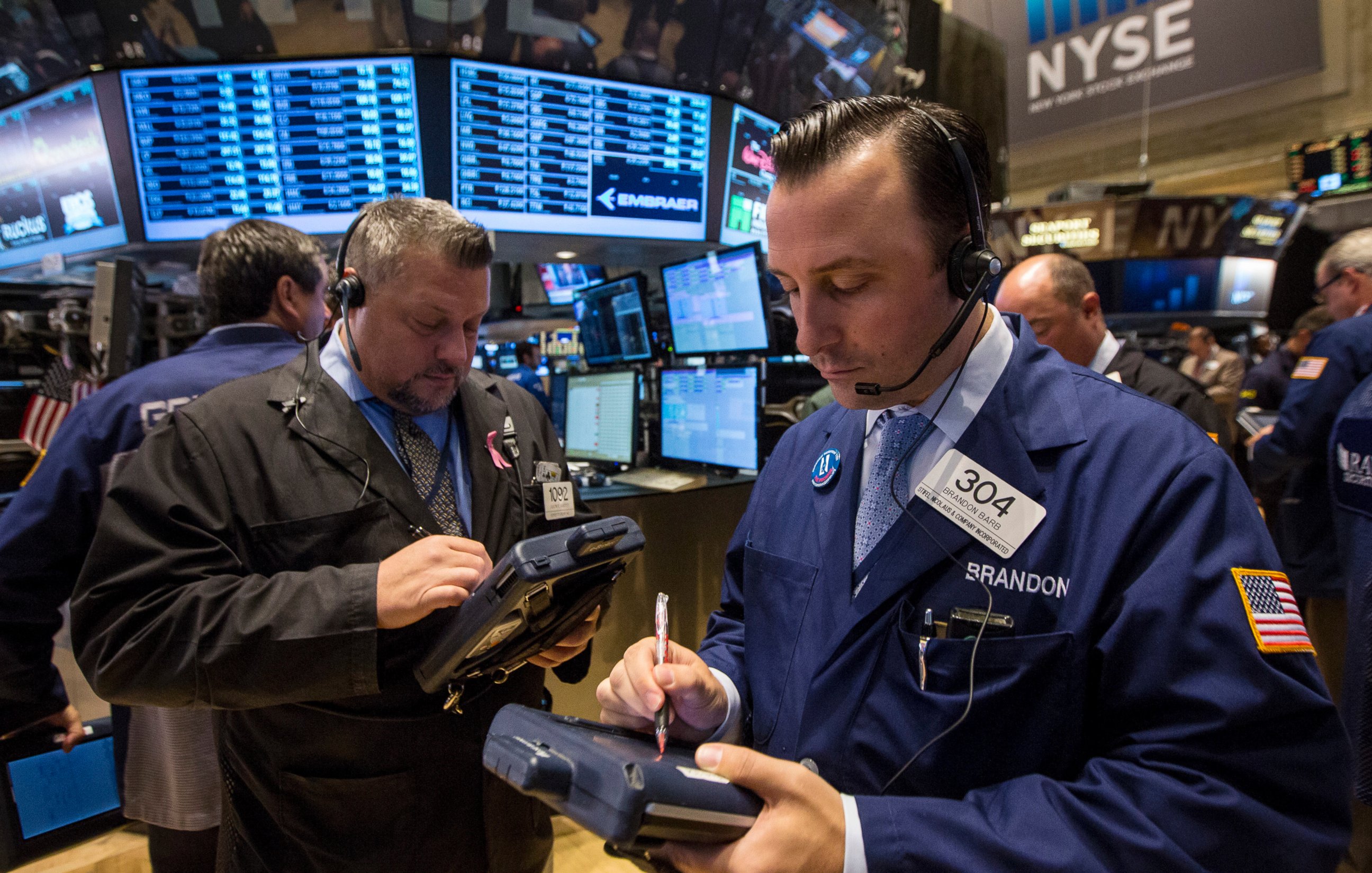 PHOTO: Traders work on the floor of the New York Stock Exchange October 1, 2014. 