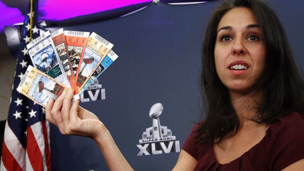 NFL Vice President for Legal Affairs Anastasia Danias holds up samples of counterfeit tickets seized from previous NFL Super Bowls during a news conference in Indianapolis, Ind., Feb. 2, 2012.