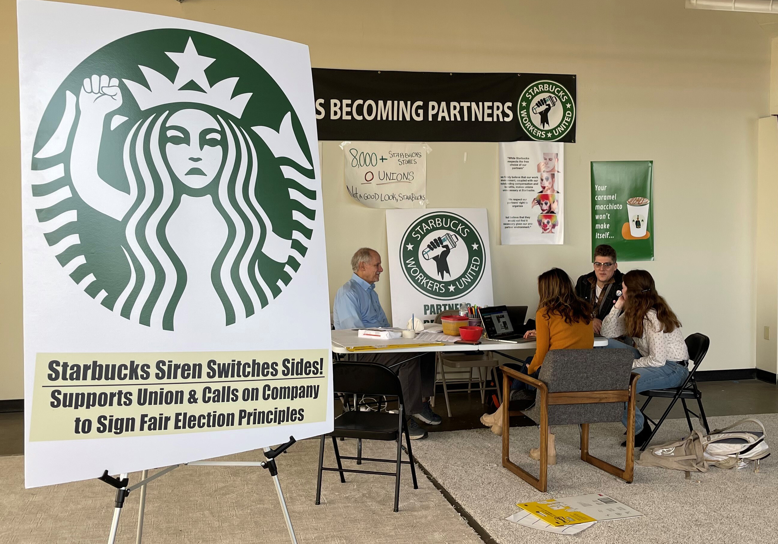 PHOTO: Richard Bensinger, left, who is advising unionization efforts, along with baristas discuss their efforts to unionize three Buffalo-area stores, inside the movements headquarters, Oct. 28, 2021, in Buffalo, N.Y. 