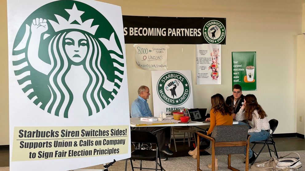 PHOTO: Richard Bensinger, left, who is advising unionization efforts, along with baristas discuss their efforts to unionize three Buffalo-area stores, inside the movements headquarters, Oct. 28, 2021, in Buffalo, N.Y. 