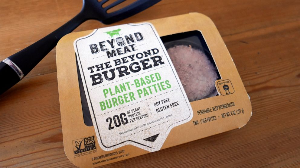 FILE - In this June 26, 2019, file photo, a package of meatless burgers by Beyond Meat are seen in Orlando, Fla. Beyond Meat reports financial earns Monday, July 29. (AP Photo/John Raoux, File)