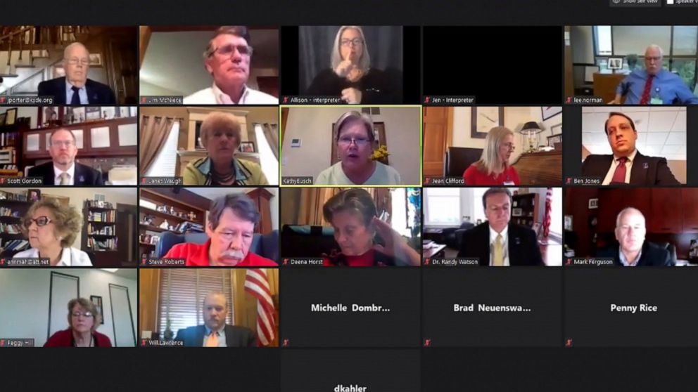 An Associated Press computer screen capture shows the Kansas State Board of Education meeting by Zoom with staff members and other state officials watching, Wednesday, July 22, 2020, in Topeka, Kan. Zoom meeting software is experiencing a partial out