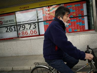 Asian markets follow Wall St up but headed for annual loss thumbnail