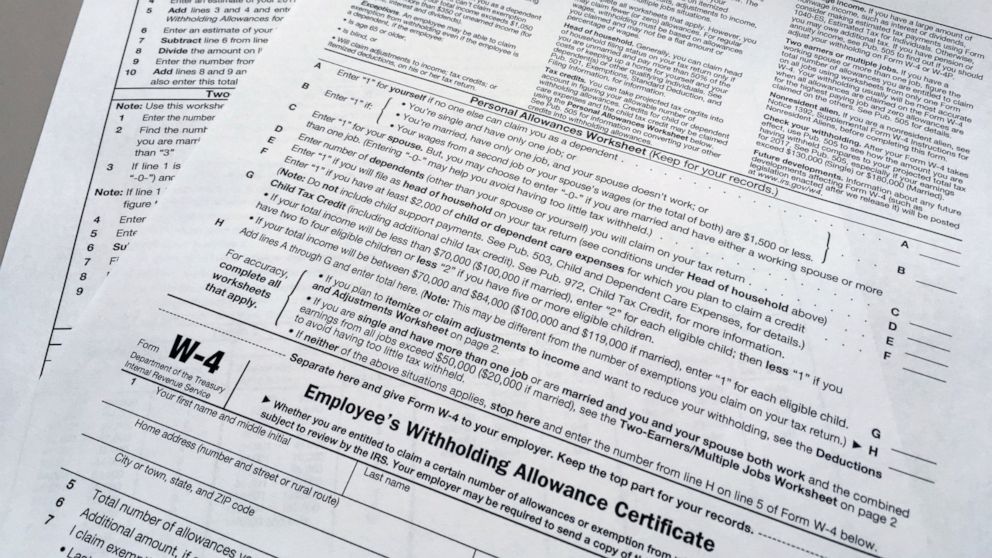 FILE - This Feb. 1, 2018 file photo shows an IRS W-4 form in New York. On Friday, May 31, 2019, the IRS is expected to release a proposed update to the form. Experts say that while it will be much more accurate, it will also be much more difficult. (