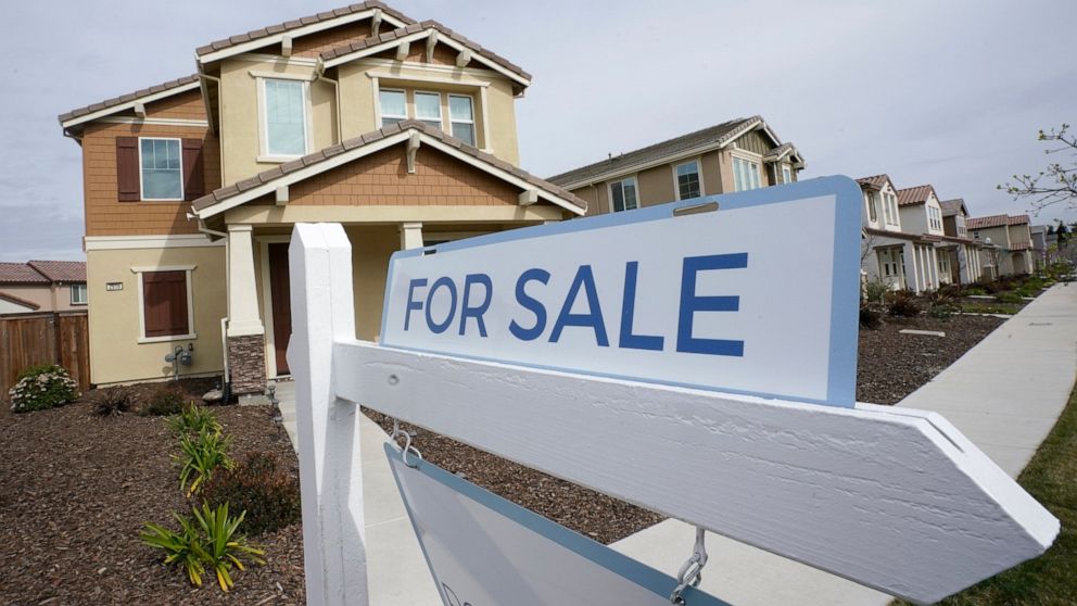 FILE - A for sale sign is posted in front of a home in Sacramento, Calif., Thursday, March 3, 2022. The California Association of Realtors is apologizing for its role in supporting discriminatory housing polices in the state. The group is backing a b