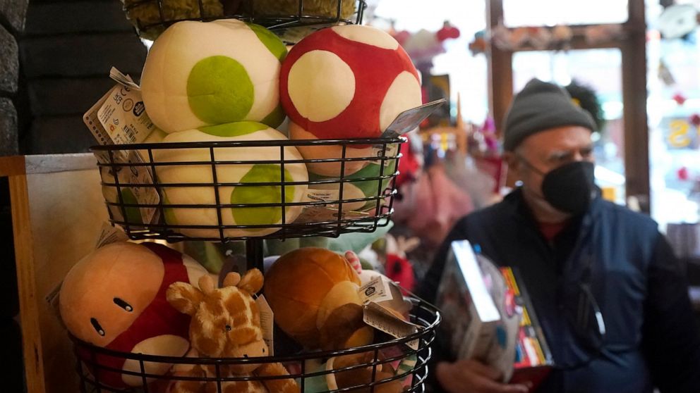 A basket of plush mushrooms and animals are shown as customers shop at a Five Little Monkeys store in Berkeley, Calif., Monday, Dec. 12, 2022. Small retailers say this year looks much different than the last "normal" pre-pandemic holiday shopping sea