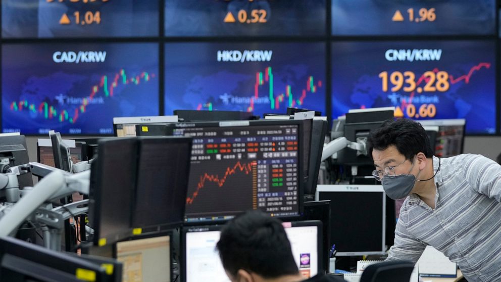 A currency trader watches monitors at the foreign exchange room of the KEB Hana Bank headquarters in Seoul, South Korea, Monday, April 18, 2022. Shares were lower in Asia after China reported Monday that its economy expanded at a 4.8% annual pace in 