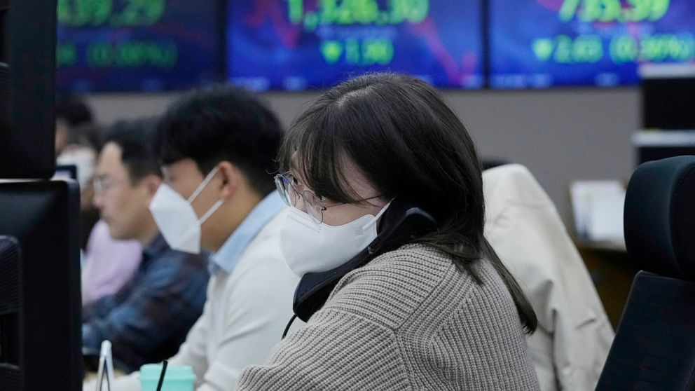 A currency trader watches monitors at the foreign exchange dealing room of the KEB Hana Bank headquarters in Seoul, South Korea, Friday, Nov. 25, 2022. Asian shares were mixed Friday as worries deepened about the regional economy and Japan reported h
