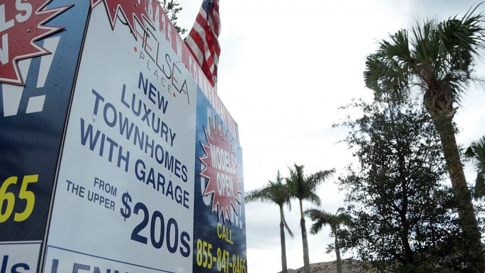 FILE - In this Sept. 22, 2016, file photo, a sign advertises Lennar Corporation townhomes which are under construction at Chelsea Place in Tamarac, Fla. Tariff concerns and a disappointing third quarter outlook are weighing on Lennar Corp.’s stock ev